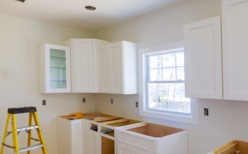 Kitchen cabinets installation Blind corner cabinet, island drawers and counter installed